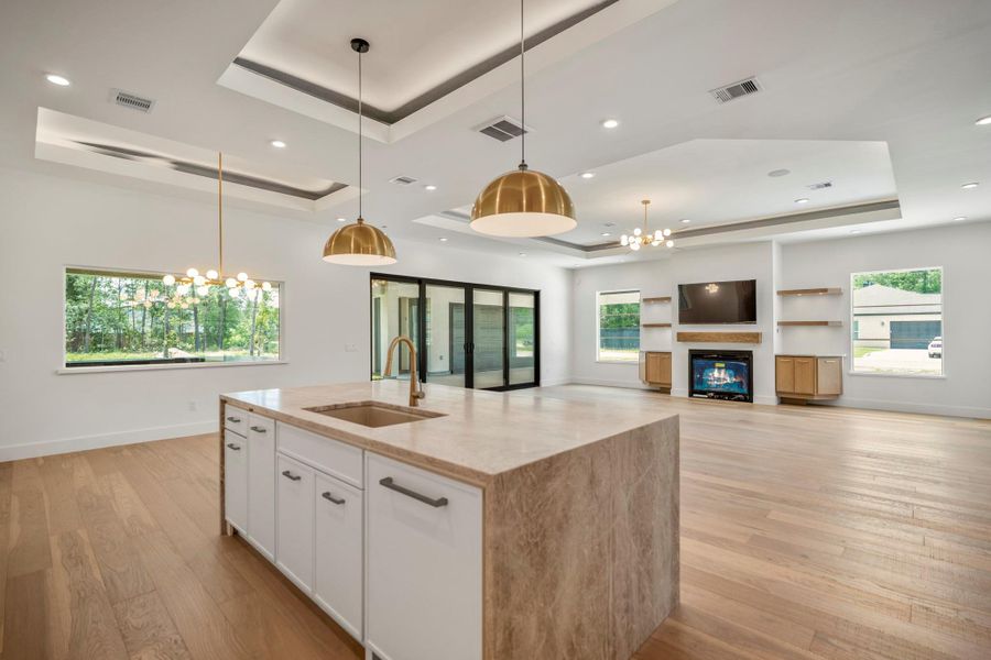 Modern ceiling design helps accentuate each area while all the windows brings in an abundance of natural lighting. Modern ceiling design helps accentuate each area while all the windows brings in an abundance of natural lighting.