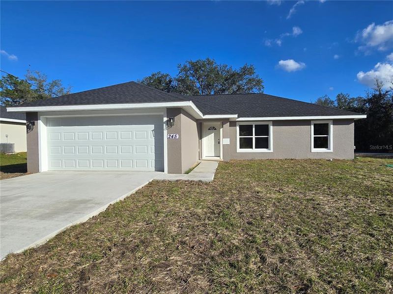 Front exterior of a new home in , Ocala, FL, highlighting curb appeal (Image 21). Front exterior of a new home in , Ocala, FL, highlighting curb appeal (Image 21).