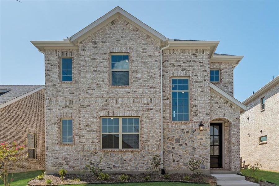 Front exterior of a new home in Arbors at Legacy Hills, Celina, TX, highlighting curb appeal (Image 2). Front exterior of a new home in Arbors at Legacy Hills, Celina, TX, highlighting curb appeal (Image 2).