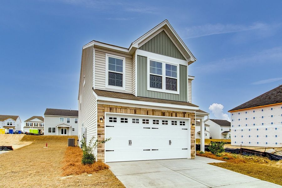 Front exterior of a new home in Winston Point, Gilbert, SC, highlighting curb appeal (Image 2).