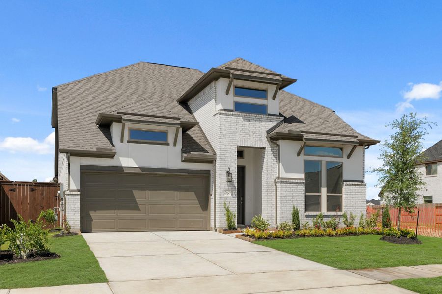 Front exterior of a new home in The Trails, New Caney, TX, highlighting curb appeal (Image 27). Front exterior of a new home in The Trails, New Caney, TX, highlighting curb appeal (Image 27).