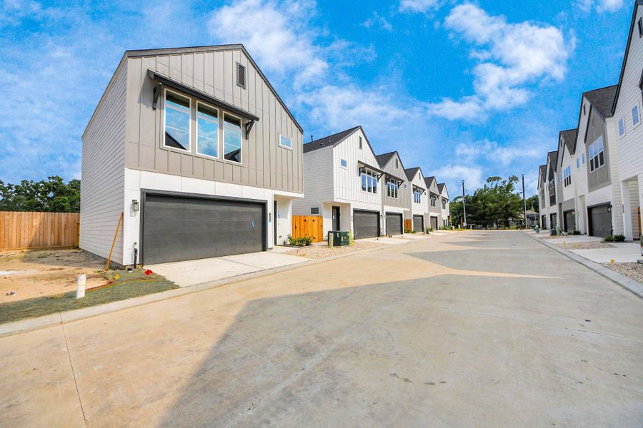 Front exterior of a new home in Highland Gardens, Houston, TX, highlighting curb appeal (Image 24).