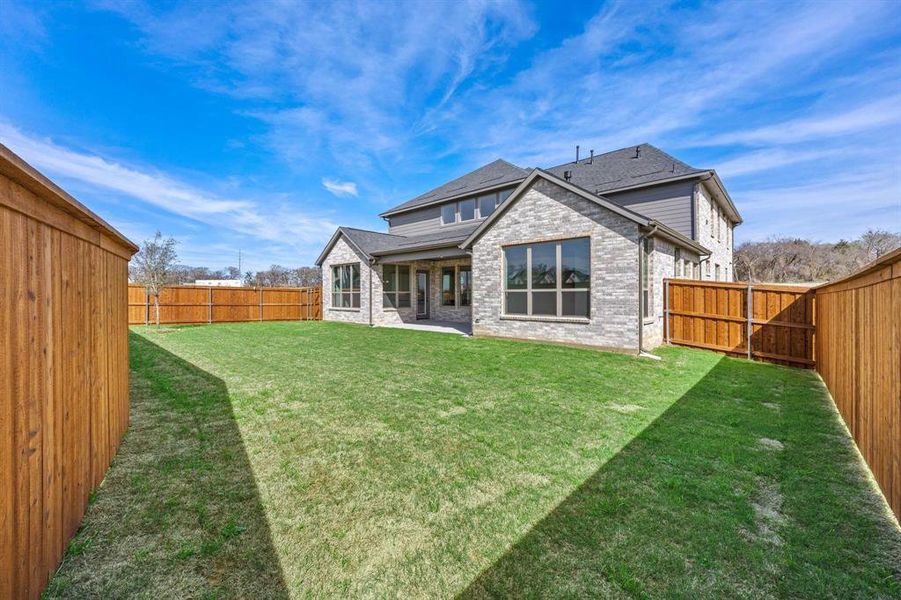 Exterior details and patio area of a home in Chatham Reserve, Providence Village (Image 3).
