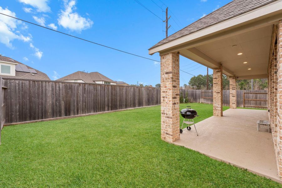 Plenty of grass for kids and pets.  Front and back irrigation system keeps your yard looking lush and green.