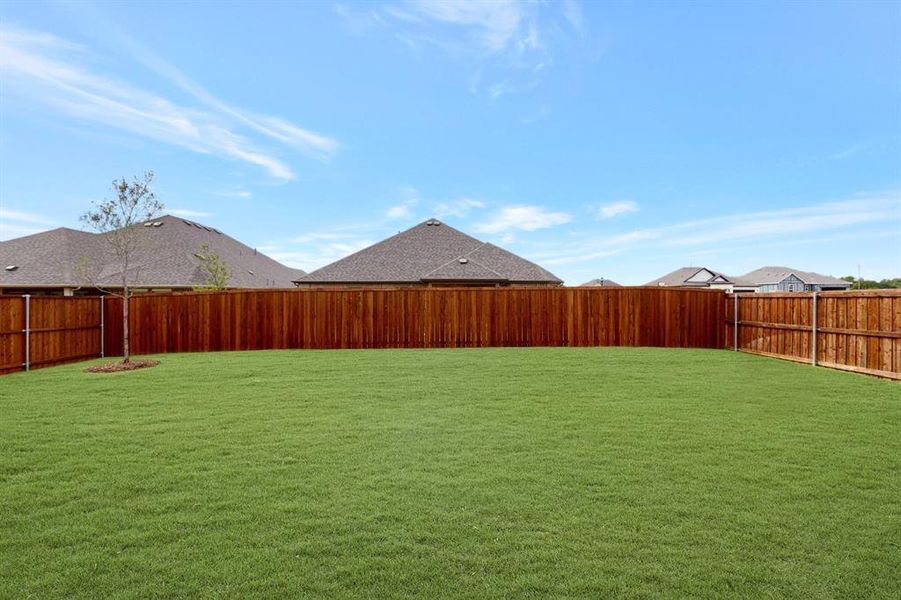 Exterior details and patio area of a home in The Preserve, Justin (Image 1).