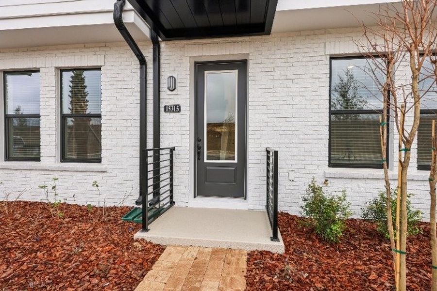 Exterior details and patio area of a home in Parkview at Hamlin, Winter Garden (Image 3).