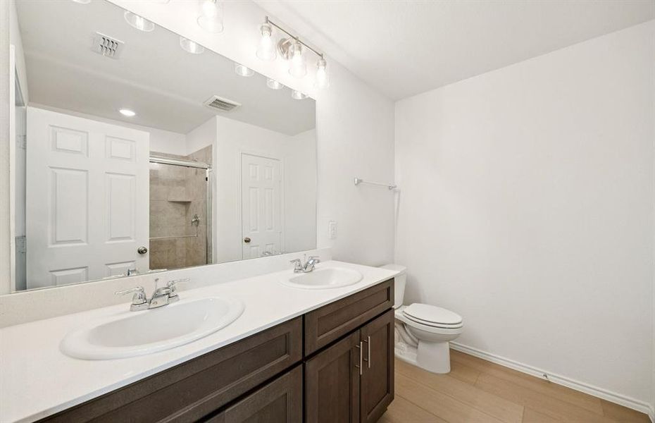 Owner's private bath with double vanity