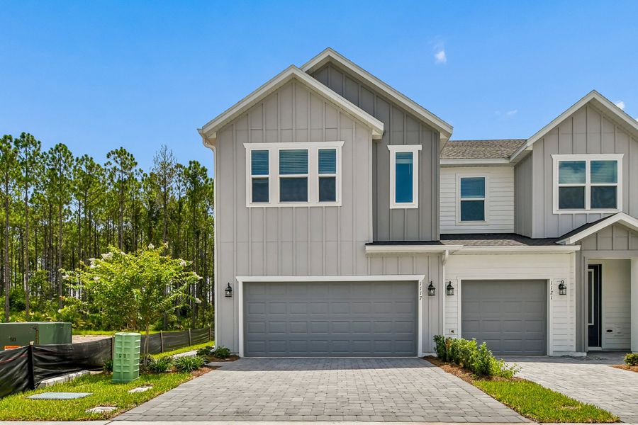 Representative exterior photo of a completed home built from the The Peppermill by David Weekley Homes in Preserve at The Cays – The Harbor Series, Daytona Beach, FL (Image 1). Representative exterior photo of a completed home built from the The Peppermill by David Weekley Homes in Preserve at The Cays – The Harbor Series, Daytona Beach, FL (Image 1).