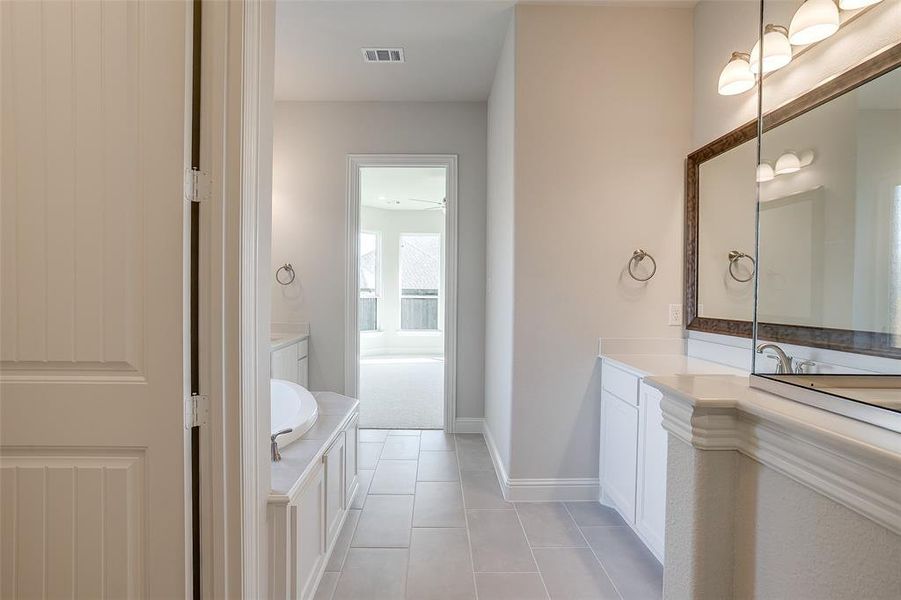 Bathroom featuring vanity and tile patterned floors