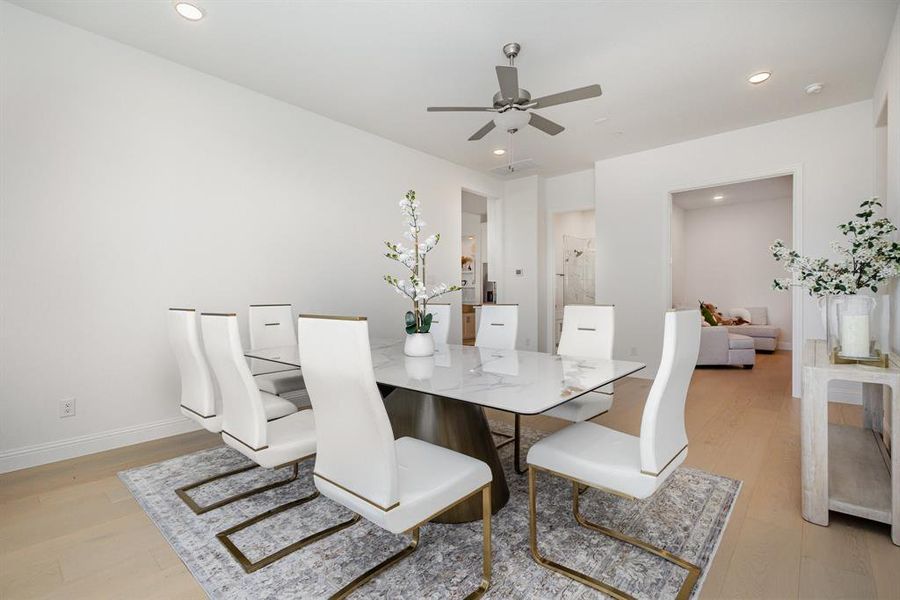 Dining space featuring light wood-type flooring, recessed lighting, and ceiling fan