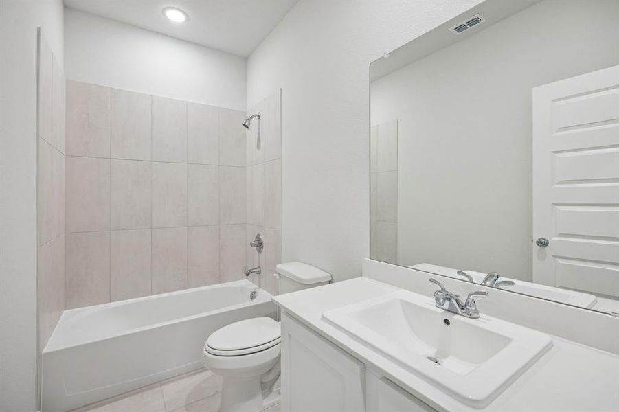 Bathroom in the Masters home plan by Trophy Signature Homes – REPRESENTATIVE PHOTO