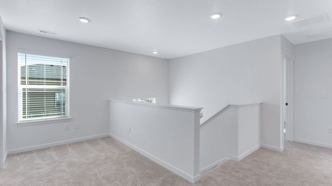 Representative unfurnished interior of a home built from the Calhan by D.R. Horton in Vantage, Berthoud (Image 19).