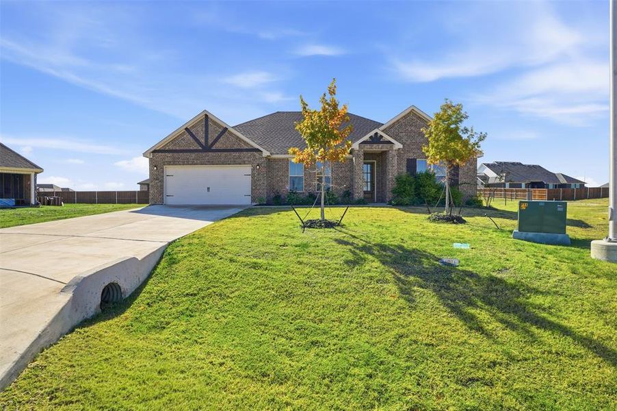 Front exterior of a new home in Wildcat Ridge, Godley, TX, highlighting curb appeal (Image 2). Front exterior of a new home in Wildcat Ridge, Godley, TX, highlighting curb appeal (Image 2).