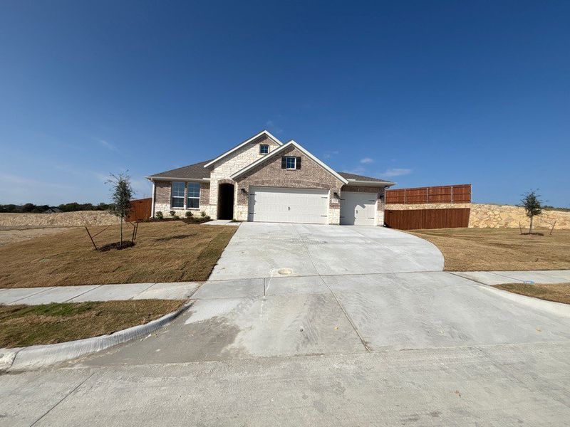 Front exterior of a new home in Waterford Park, Weatherford, TX, highlighting curb appeal (Image 1). Front exterior of a new home in Waterford Park, Weatherford, TX, highlighting curb appeal (Image 1).