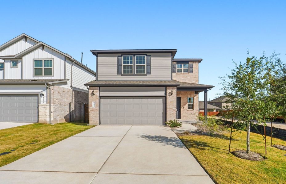 Front exterior of a new home in Saddleback at Santa Rita Ranch, Liberty Hill, TX, highlighting curb appeal (Image 19).
