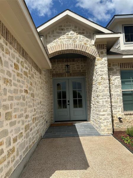 Stone veneer exterior with brick archway detailing