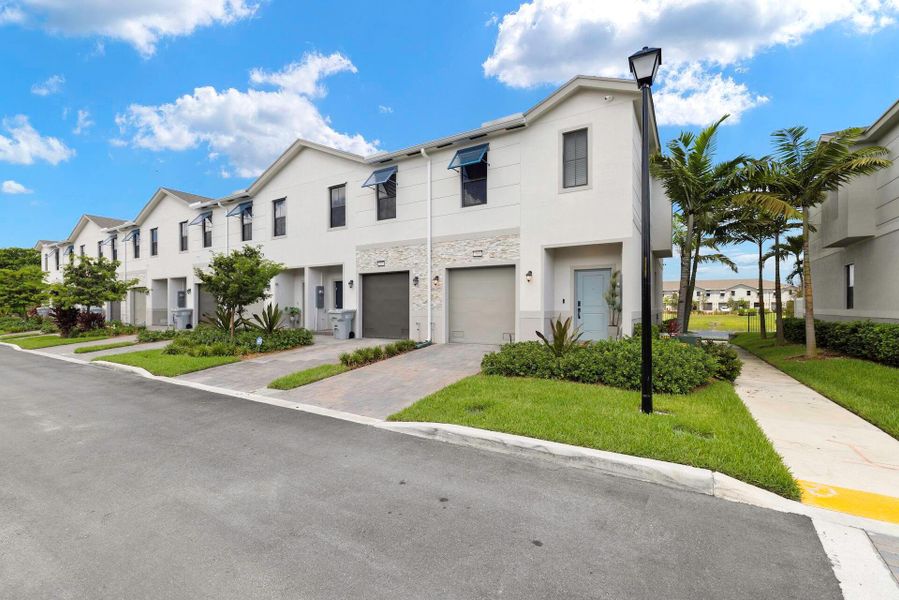 Front exterior of a new home in , Pompano Beach, FL, highlighting curb appeal (Image 2). Front exterior of a new home in , Pompano Beach, FL, highlighting curb appeal (Image 2).