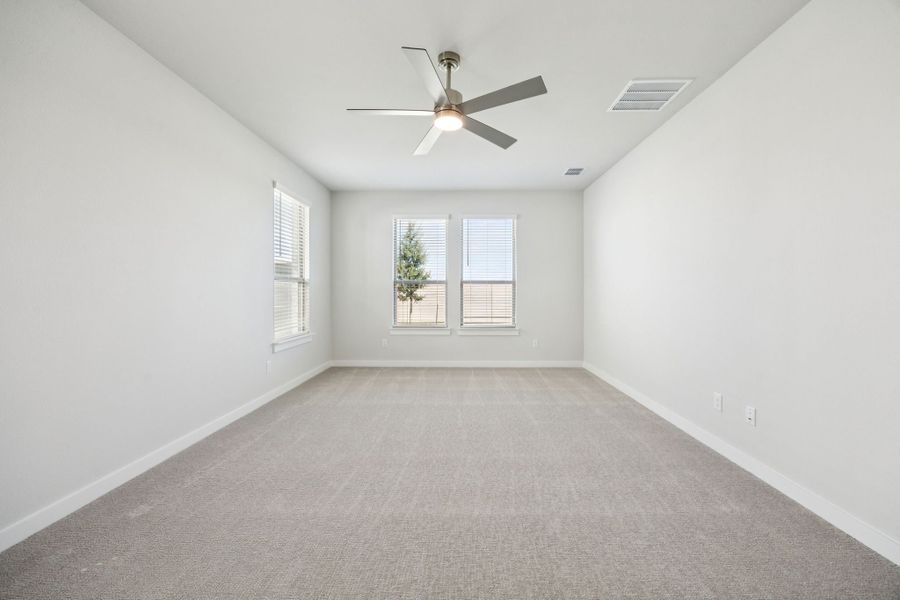 Primary Suite in the Wimbledon home plan by Trophy Signature Homes – REPRESENTATIVE PHOTO