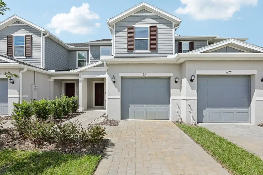 Front exterior of a new home in Reserve at Forest Lake Townhomes, Lake Wales, FL, highlighting curb appeal (Image 2). Front exterior of a new home in Reserve at Forest Lake Townhomes, Lake Wales, FL, highlighting curb appeal (Image 2).