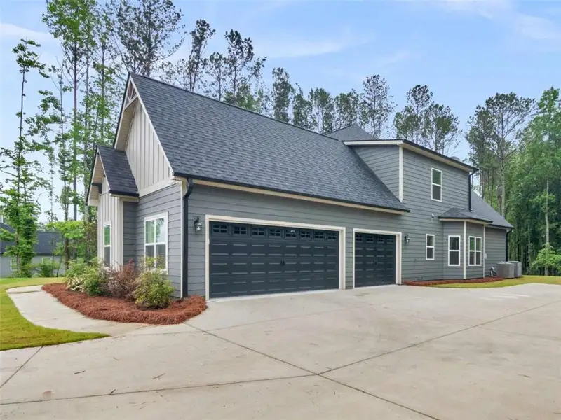 Front exterior of a new home in , Newnan, GA, highlighting curb appeal (Image 2). Front exterior of a new home in , Newnan, GA, highlighting curb appeal (Image 2).