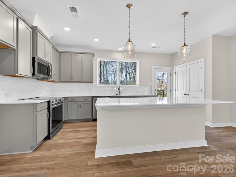 Furnished interior view inside a new home in Central Living at Craig, Charlotte (Image 7).