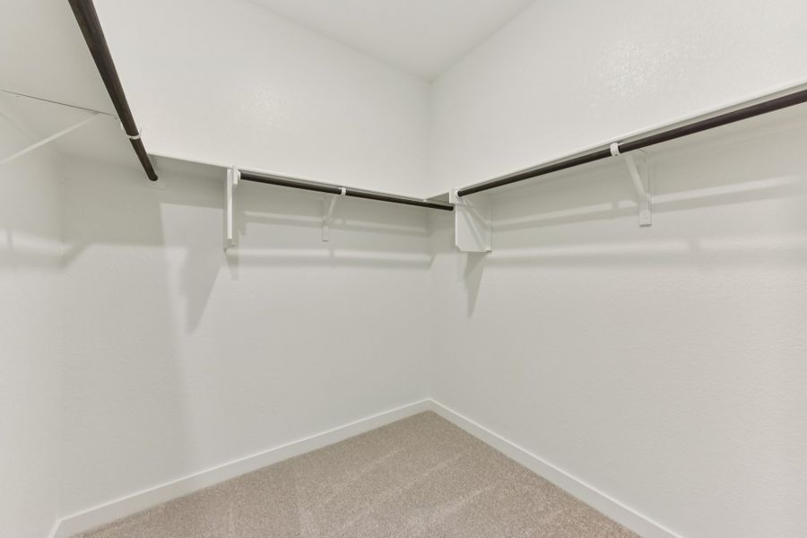 A white wall with a metal railing. A white wall with a metal railing.