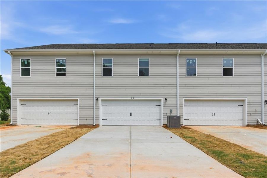 Front exterior of a new home in Avery Landing, McDonough, GA, highlighting curb appeal (Image 17).
