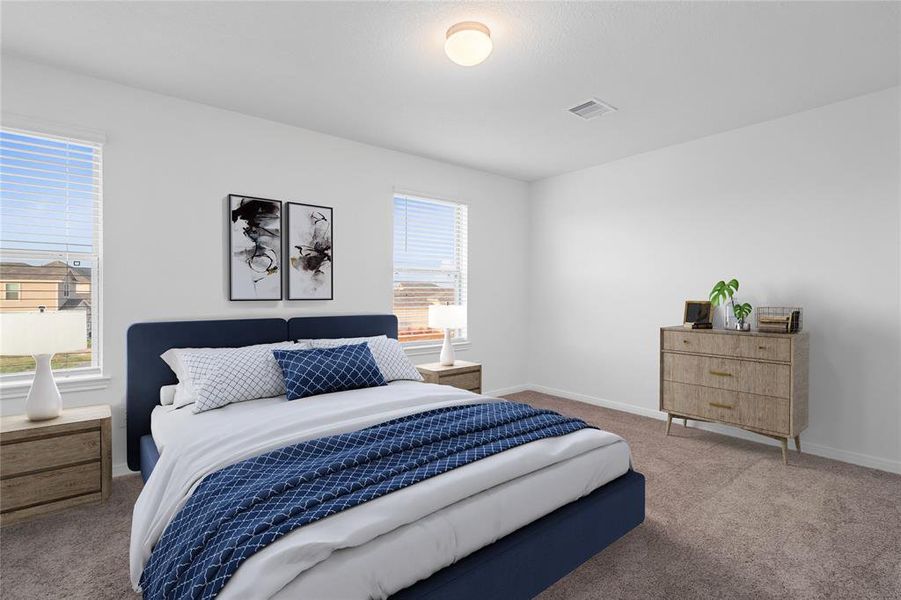 Secondary bedroom features plush carpet, neutral paint, lighting, windows with privacy blinds and ample sized closet space.