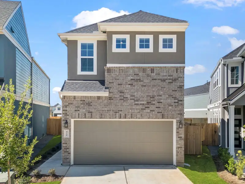 Front exterior of a new home in Sienna, Missouri City, TX, highlighting curb appeal (Image 1). Front exterior of a new home in Sienna, Missouri City, TX, highlighting curb appeal (Image 1).