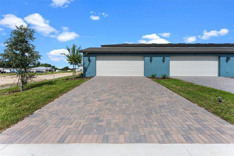 Front exterior of a new home in Eden Crest, Apopka, FL, highlighting curb appeal (Image 23). Front exterior of a new home in Eden Crest, Apopka, FL, highlighting curb appeal (Image 23).