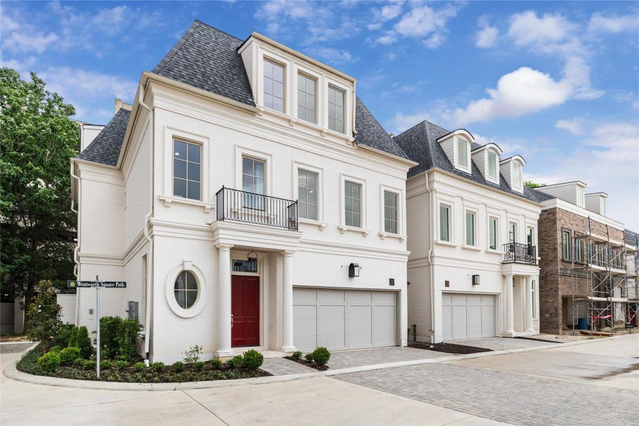 Entry features a solid African Mahogany front door with a glossy lacquered finish, premium Emtek door hardware, and Abaco copper gas lanterns. Painted brick exterior, adorned with trim compliments and accents, along with professionally landscaped front exteriors adds a touch of elegance and further enhance the overall curb appeal of the community. Entry features a solid African Mahogany front door with a glossy lacquered finish, premium Emtek door hardware, and Abaco copper gas lanterns. Painted brick exterior, adorned with trim compliments and accents, along with professionally landscaped front exteriors adds a touch of elegance and further enhance the overall curb appeal of the community.