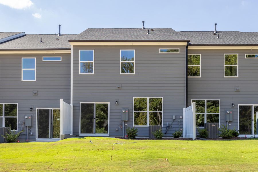 Exterior details and patio area of a home in Running Brook Townes, Durham (Image 2). Exterior details and patio area of a home in Running Brook Townes, Durham (Image 2).