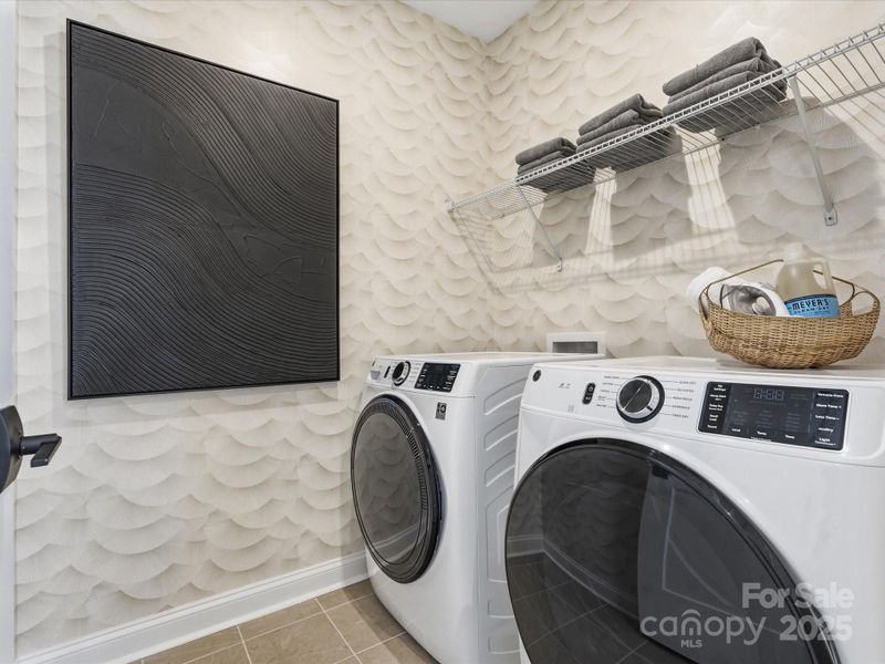 Laundry Room Featuring Modern Tile Design. *Model Photos | Actual Finishes, Structural Selections, and Orientation May Vary. Laundry Room Featuring Modern Tile Design. *Model Photos | Actual Finishes, Structural Selections, and Orientation May Vary.