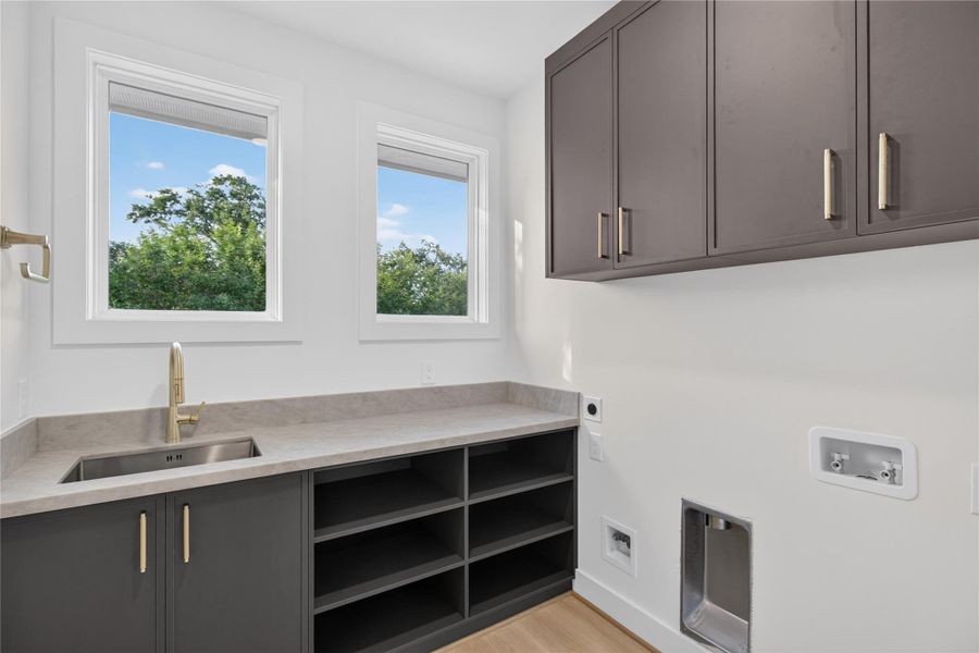 Designed with convenience in mind, the spacious utility room offers functionality without sacrificing style. Designed with convenience in mind, the spacious utility room offers functionality without sacrificing style.