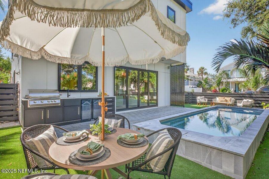 Exterior details and patio area of a home in , Neptune Beach (Image 46).