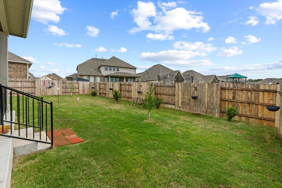 Fully enclosed by a privacy fence, it’s a secure and serene environment for pets, play, and peaceful afternoons.