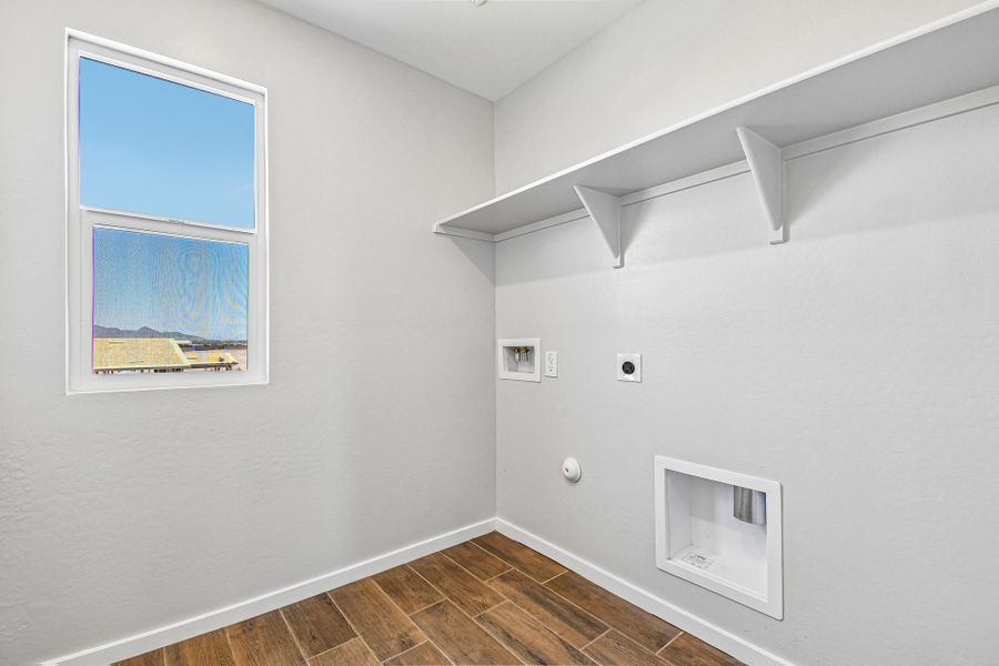 A room with a window and a painting on the wall. A room with a window and a painting on the wall.