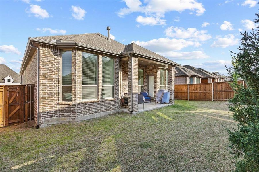 Exterior details and patio area of a home in Gateway Village - The Reserve, Denison (Image 22).