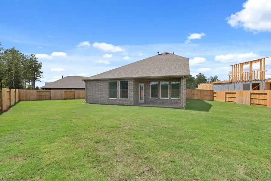 Exterior details and patio area of a home in The Trails, New Caney (Image 4).