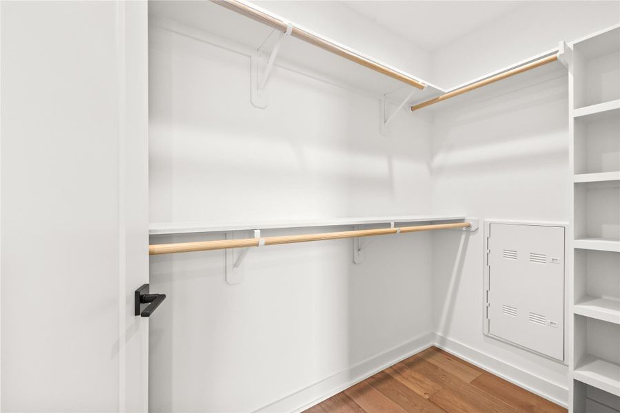 Spacious walk-in closet with custom built-in shelving