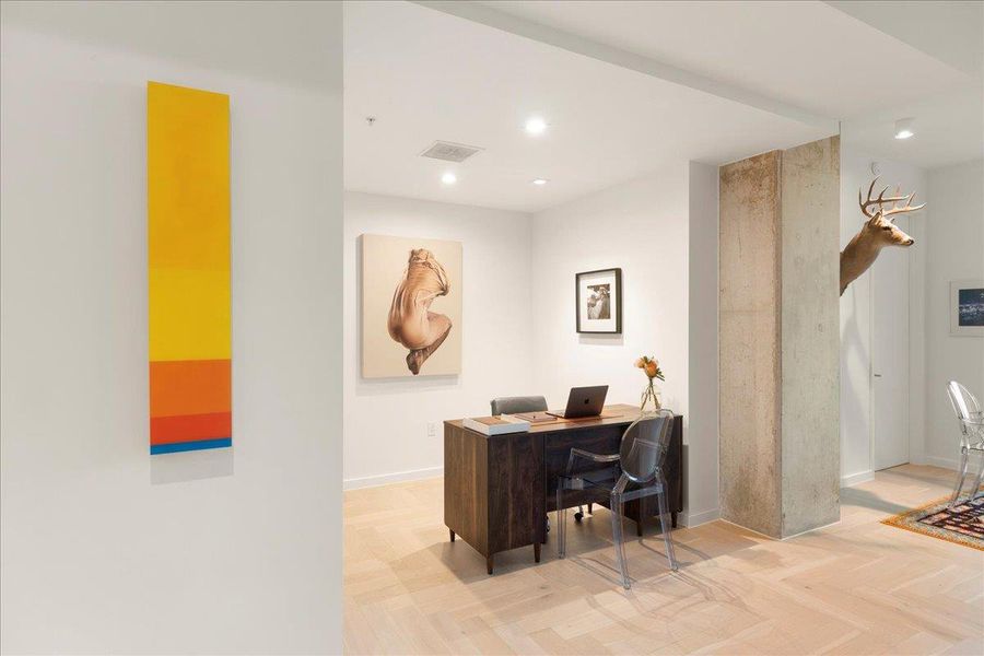 Spacious den that offers the perfect flex space for a home office, creative studio, or private retreat. Natural light and clean lines make it as functional as it is inviting.