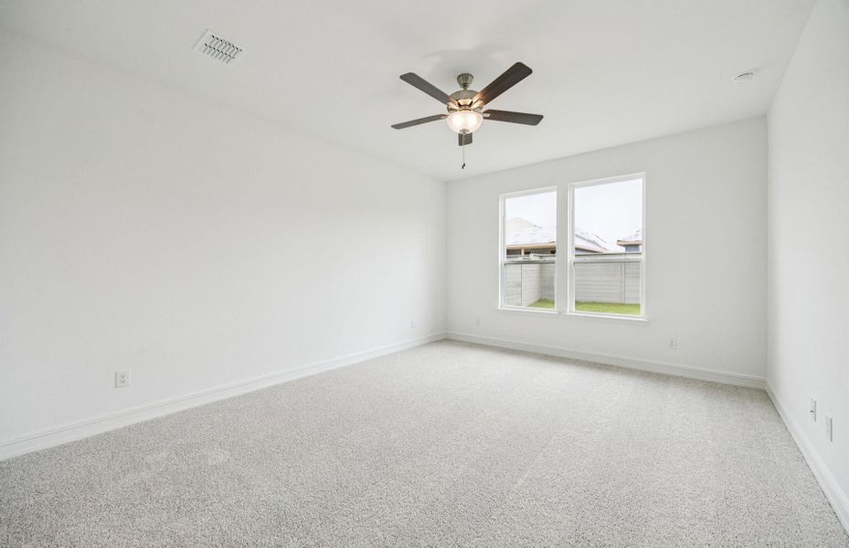 Elegant Owner's suite with beautiful finishes and ample floor space  *Real home pictured