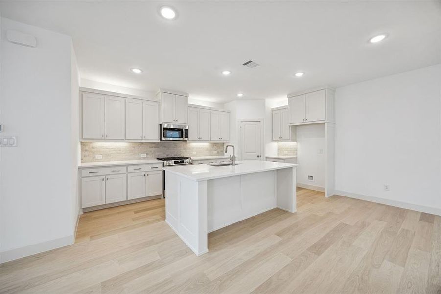 With ample storage and prep space, this dream kitchen is all that you have been searching for!