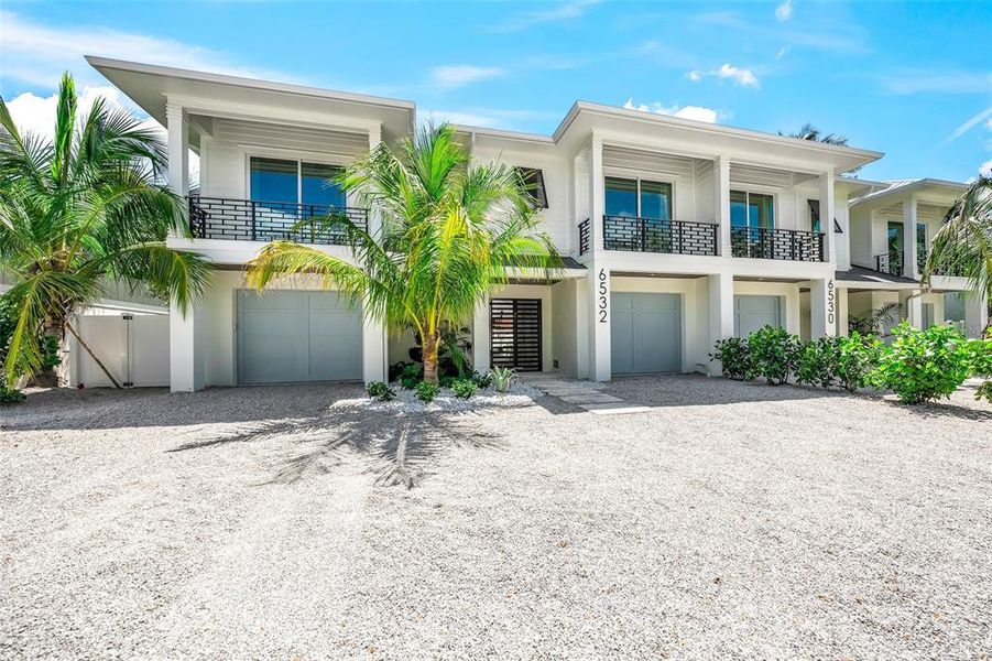 Front exterior of a new home in , Sarasota, FL, highlighting curb appeal (Image 23).
