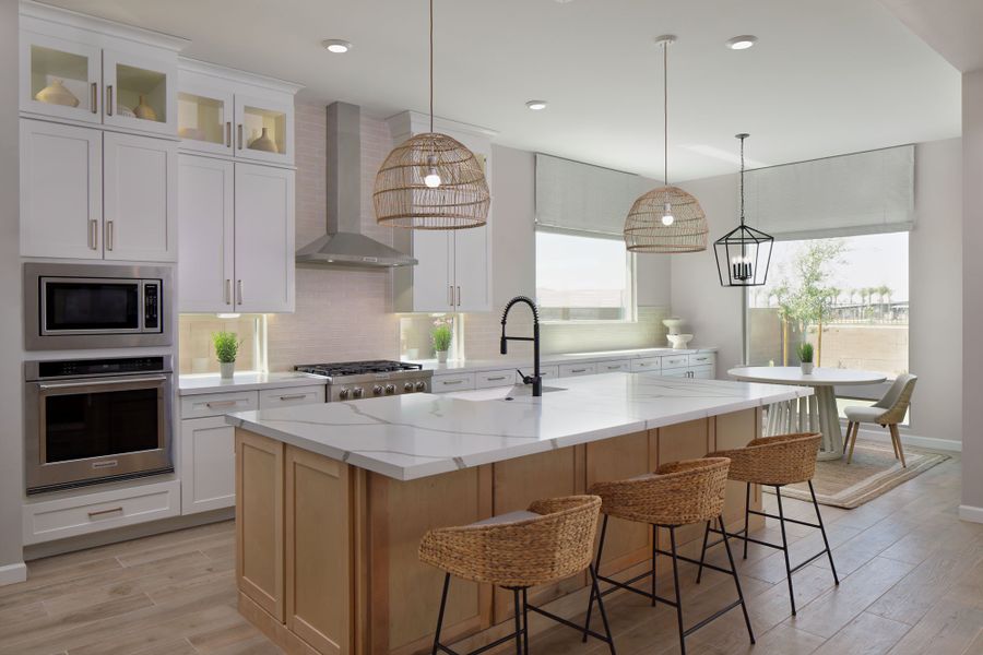 Kitchen and dining. Finishes and options may vary by community.