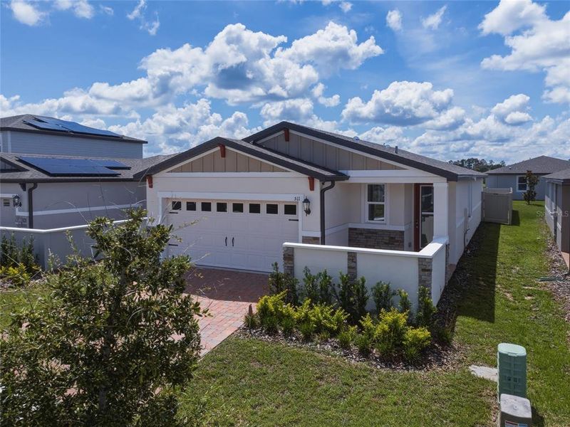 Front exterior of a new home in Springs at Lake Alfred - Classic Series, Lake Alfred, FL, highlighting curb appeal (Image 23).