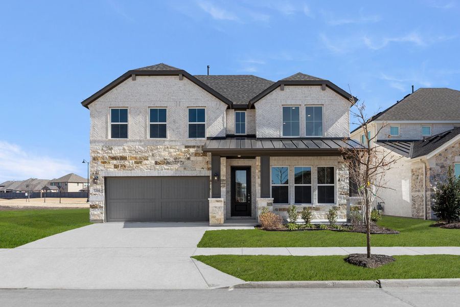 Front exterior of a new home in Union Park, Little Elm, TX, highlighting curb appeal (Image 1). Front exterior of a new home in Union Park, Little Elm, TX, highlighting curb appeal (Image 1).