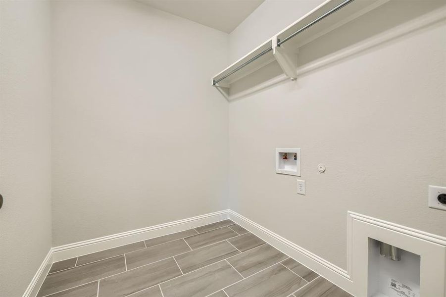 Laundry room featuring washer hookup, hookup for an electric dryer, and hookup for a gas dryer