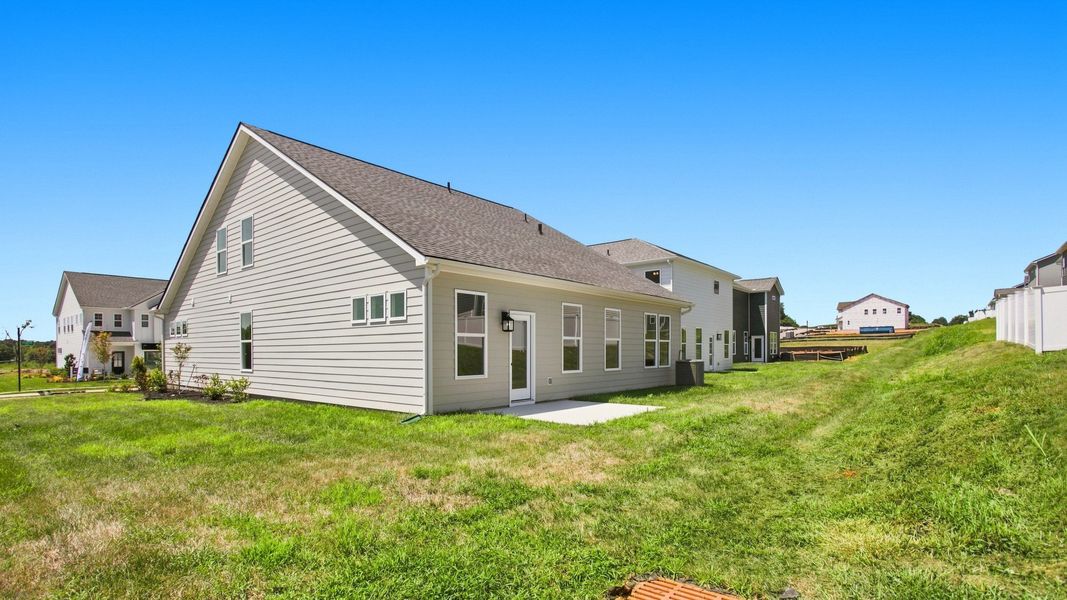Rear of Home with concrete patio, Backyard, and large side yard
