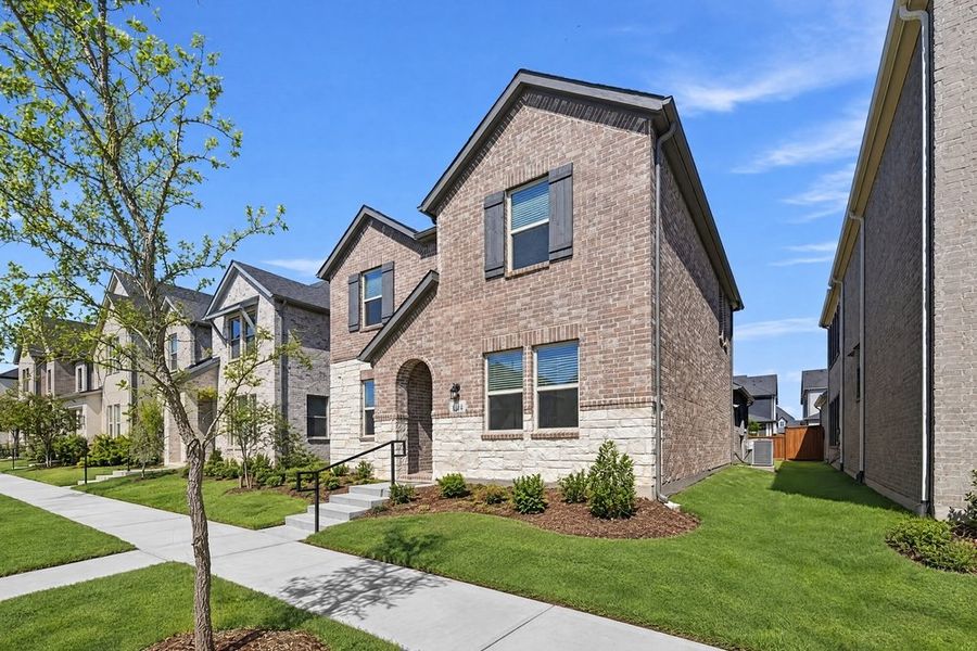 Front exterior of a new home in Cross Creek Meadows, Celina, TX, highlighting curb appeal (Image 20). Front exterior of a new home in Cross Creek Meadows, Celina, TX, highlighting curb appeal (Image 20).